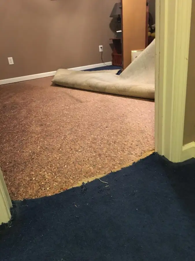Carpet pad removal revealing water damage during Drying & Dehumidification in Blanchard